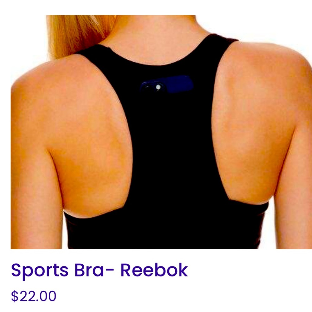White, Reebok sports bra with cellphone holder.